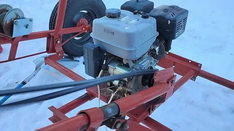 Small gas engine powering a grain auger 스톡 동영상 327536842