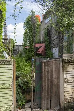 Small gate is open to a garden Stock-Fotos