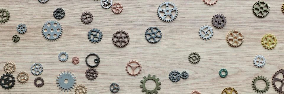Small gears and cogs representing brain functioning on table 写真素材