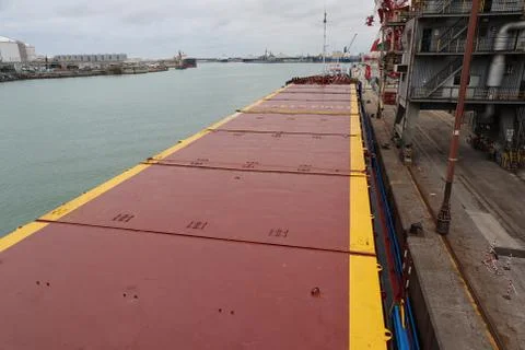 Small general cargo ship berthed at sea port Stock-Fotos
