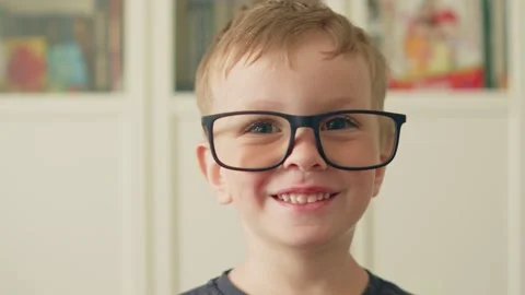 Small genius kid wearing big glasses. Smiling smart little boy in oversized.. Stock Footage 335504642