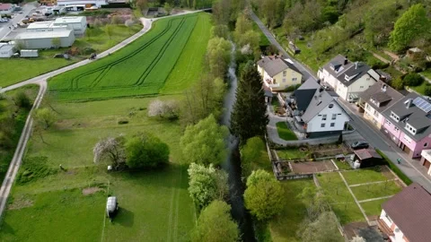 Small German village next to a river and a forest Stock Footage 154368498