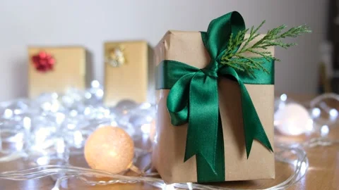 Small gift box with green ribbons and effect led lights on the back decorated Vídeo Stock 142059873