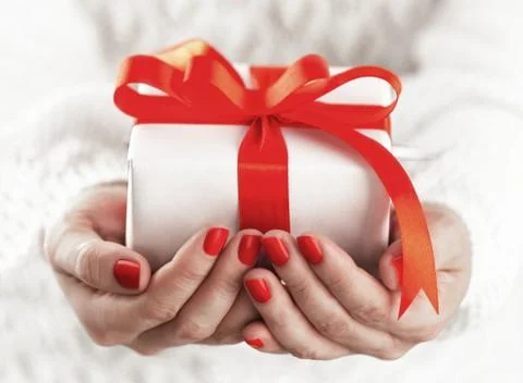 Small gift box in hands Stock Photos
