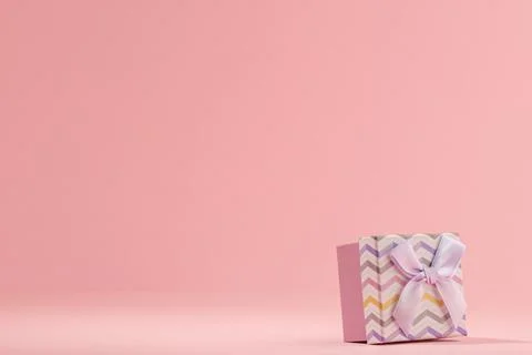 Small gift box on pink background with copy space Stock Photos