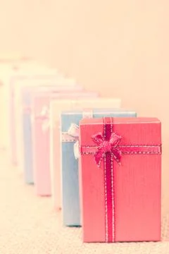 Small gift box set on sack cloth Stock Photos