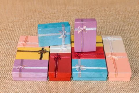 Small gift box set on sack cloth Stock Photos
