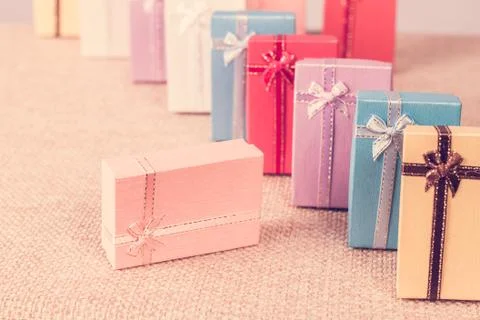 Small gift box set on sack cloth Stock Photos