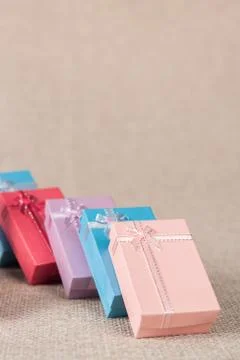 Small gift box set on sack cloth Stock Photos