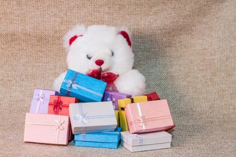 Small gift box set with teddy bear Stock Photos
