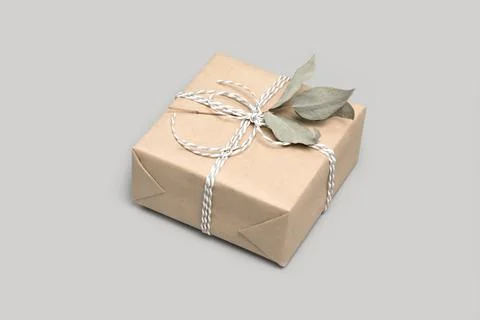 Small gift box on solid gray background Stock Photos