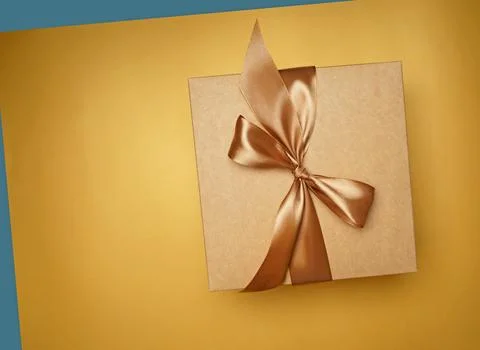 Small gift box on yellow background. top view Stock Photos