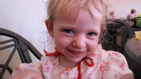 Small girl bats at camera Video stock 64531232