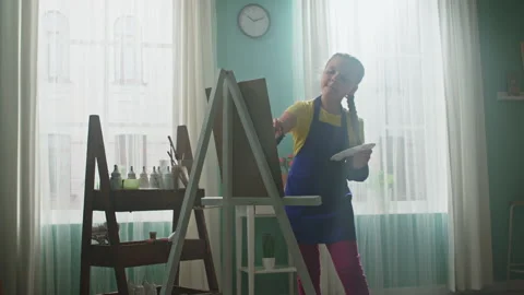 Small Girl Is Captivated by Creative Activity Stock Footage 150094460