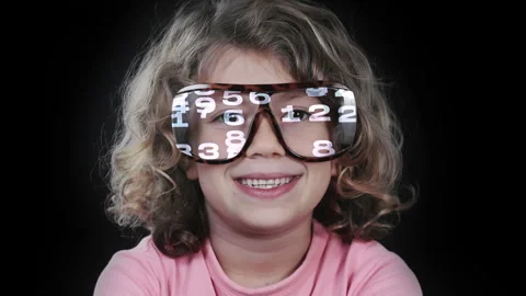 A small girl with glasses with code Stock Footage 321648376