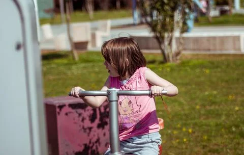 Small girl playing on the playground Stock Photos