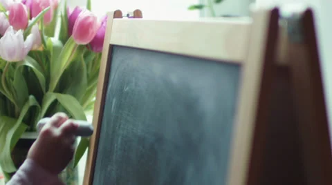 Small girl practicing simple math on chalk board Stock Footage 35253059