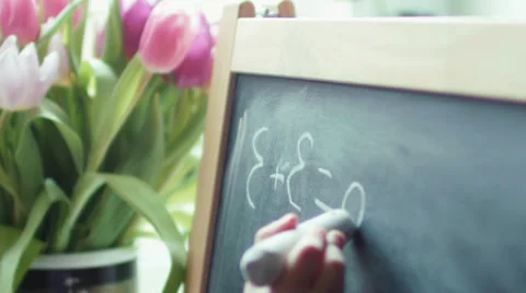 Small girl practicing simple math on chalk board Stock Footage 35253107
