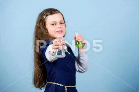 Small girl scientist with testing flask. back to school. science research in lab Stock Photos