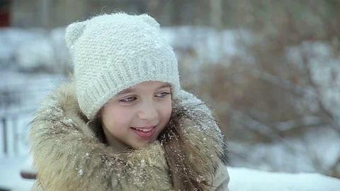 Small girl snowfall slow motion Stock Footage 73354918