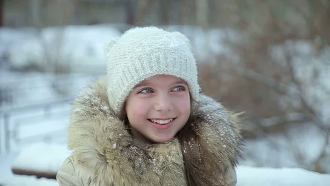 Small girl snowfall slow motion Stock Footage 73355021