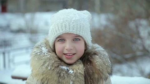 Small girl snowfall slow motion Stock Footage 73355071
