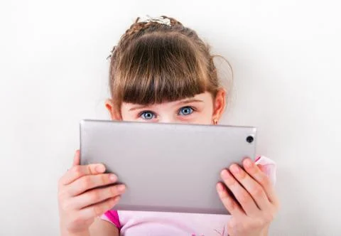 Small Girl with Tablet Computer Stock Photos