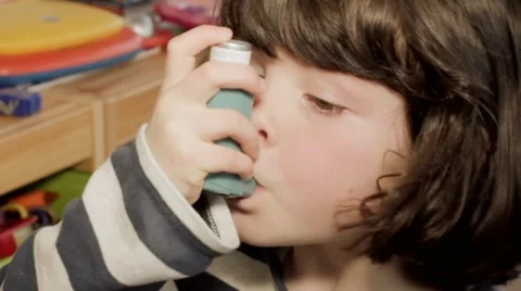 Small girl using asthma inhaler Video stock 10824563