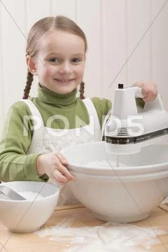 Small Girl Using Electric Mixer