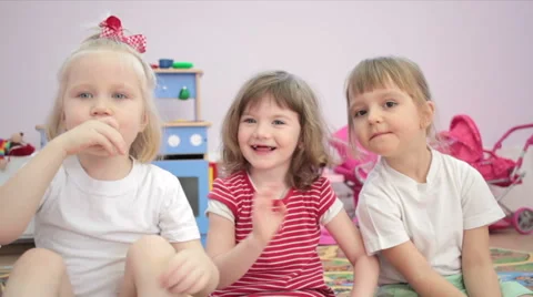 Small girls making a funny face in the kindergarten 스톡 동영상 62198522