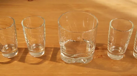 Small glasses and a whiskey one Stock Footage 50734112