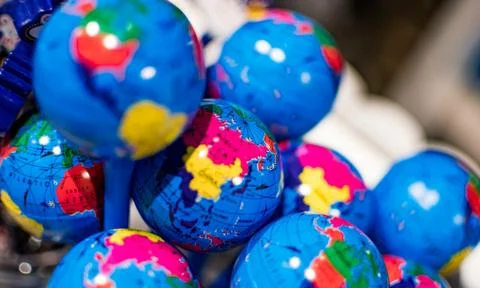 Small globe earth keychains. Keychains of Globe being sold in a store Stock Photos