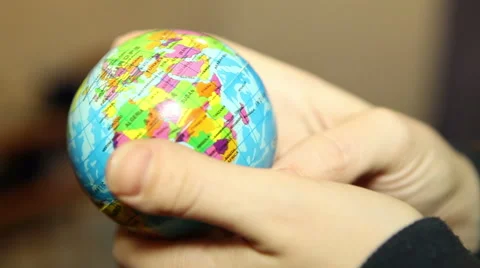 Small globe in the hands of women Stock Footage 58809196