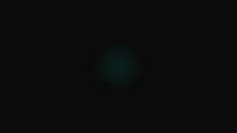 A small glowing green geometric pattern centered in a vast dark void Stock Footage 339619255