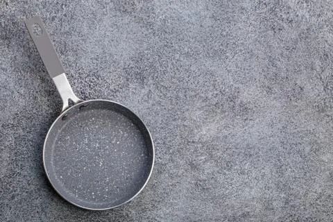 Small gray pan on gray Stockfoto's