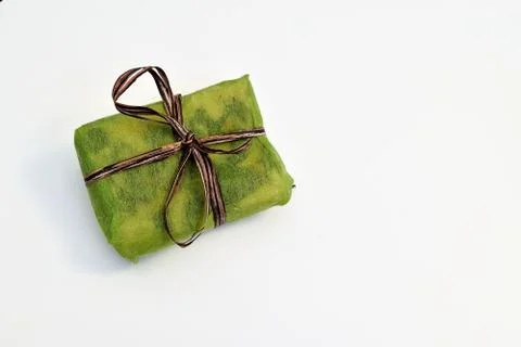 Small green gift boxes with brown ribbon Stock Photos