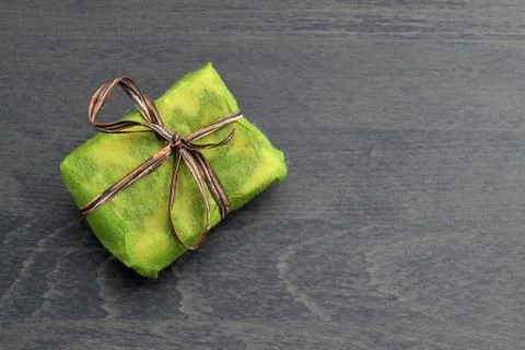 Small green gift boxes with brown ribbon Stock Photos
