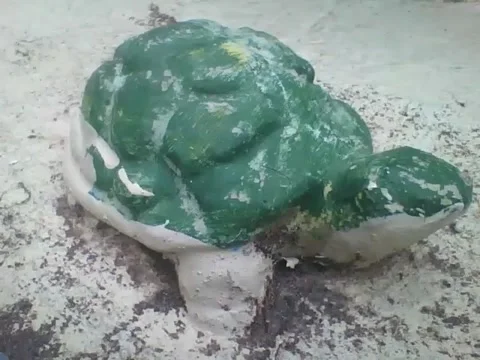 Small green stone-shaped turtle, is a beautiful work of art! Stock Footage 161755541