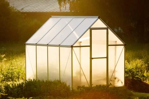 Small greenhouse in backyard Stock Photos