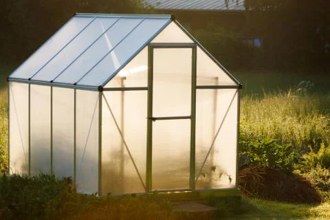 Small greenhouse in backyard Stock Photos