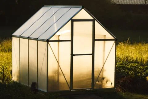 Small greenhouse in backyard Stock Photos
