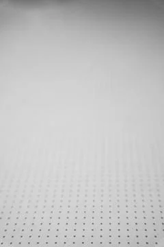 Small grey squares on a white background. Blurred perspective. Stockfoto's