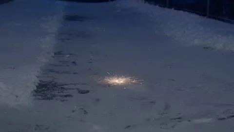 Small Ground Firework Spinning On Snow During New Year Night Stock Footage 327429553