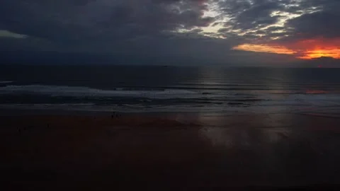 Small group of people admiring the sunset at dusk on Freshwater West Beach Stock Footage 278520096