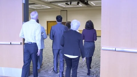 Small group of people checking out a venue for an event Stock Footage 77081289