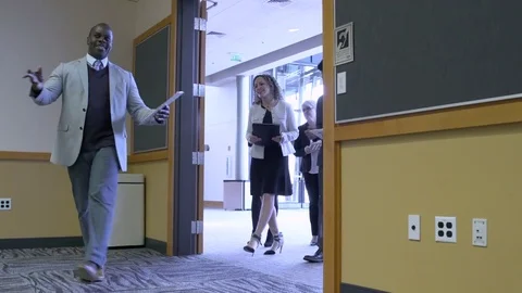 Small group of people checking out a venue for an event 動画素材 77081294