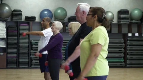 Small group of people exercising with hand weights Stock-Footage 83394100