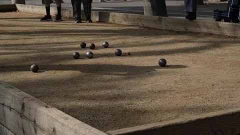 Small group of people playing petanche (bocce). Stock Footage 198065660