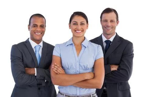Small group of smiling business people standing together Stock Photos