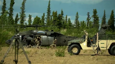 Small Group of Soldiers Getting off a Blackhawk Helicopter Stock Footage 130361696